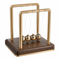 Goldbraunes Newton Pendel Tischdekoration